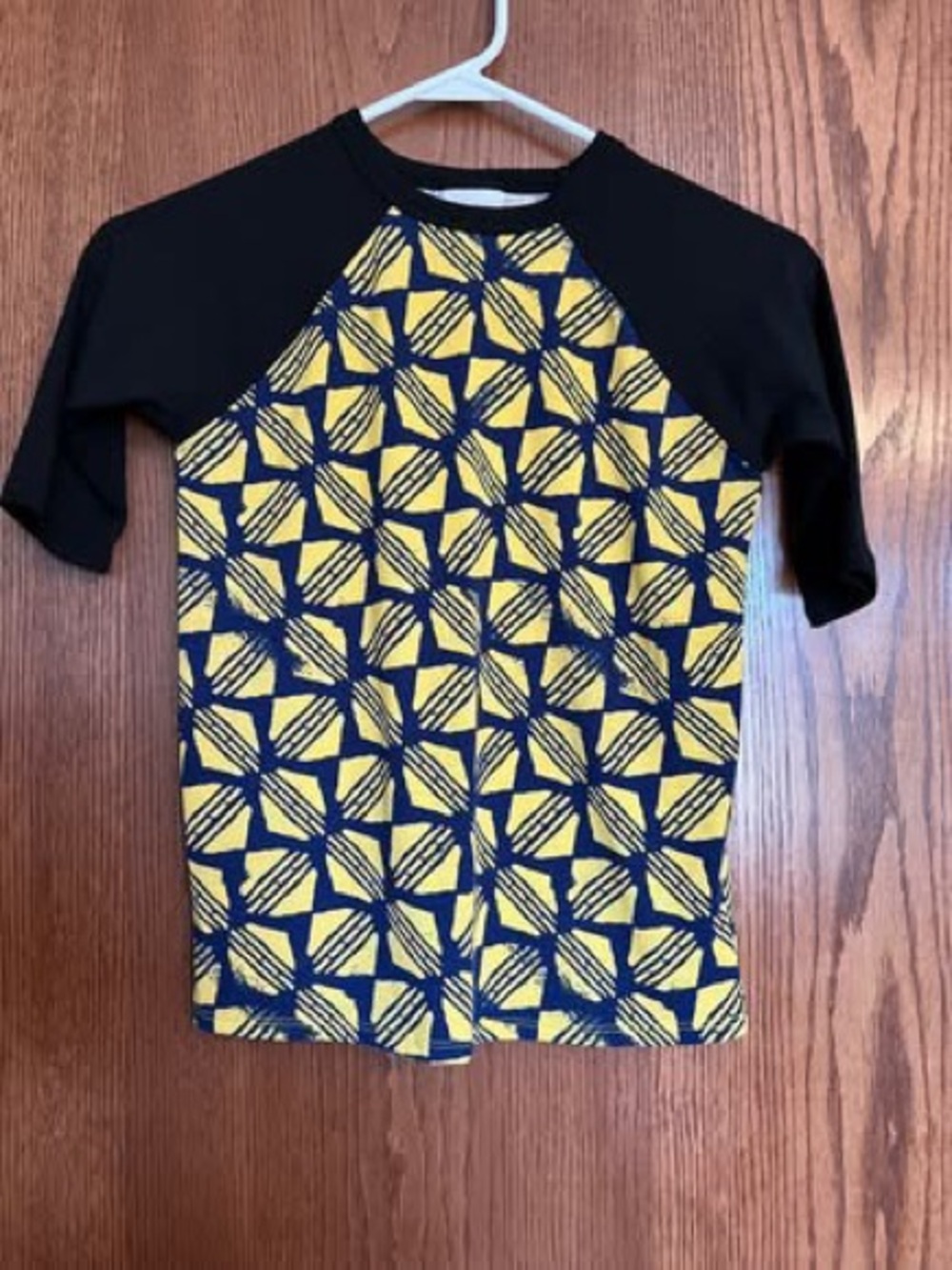 LuLaRoe Black and Yellow Geometric Rashguard Top
